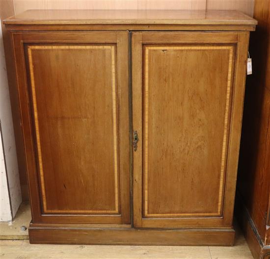 An Edwardian satinwood banded two-door mahogany side cabinet W.108cm